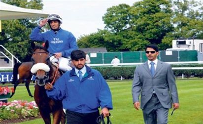 UAE jockey Ahmad Ajtebi being led in on his horse CrimeScene after winning the Shadwell Beech House Stud Stakes(Class I) on the second day of the Dubai Summer Festivalon Saturday.