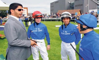 Godolphin trainer Saeed Bin Surour having a chat withchampion jockey Frankie Dettori and Ajtebi.